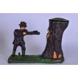 A RETRO CAST IRON MONEY BOX, in the form of a huntsman shooting a bear in a tree stump. 24 cm wide.