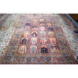 AN UNUSUAL EARLY 20TH CENTURY PERSIAN WORSTED WOOL RUG, decorated with panels depicting foliage