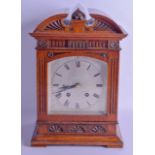 A 19TH CENTURY CARVED OAK LENZKIRCH MANTEL CLOCK with scrolling case and floral decoration. 33 cm