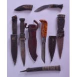 A GROUP OF FIVE VINTAGE DAGGERS in various forms and sizes. Largest 23 cm long. (5)