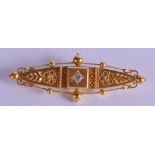 A VICTORIAN 15CT GOLD AND DIAMOND BROOCH. 5.2 grams. 4.75 cm wide.