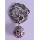 A SILVER ENAMEL AND MARCASITE EGG LOCKET PENDANT.