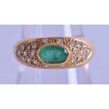 AN 18CT GOLD DIAMOND AND EMERALD RING. Size. Size O/P.