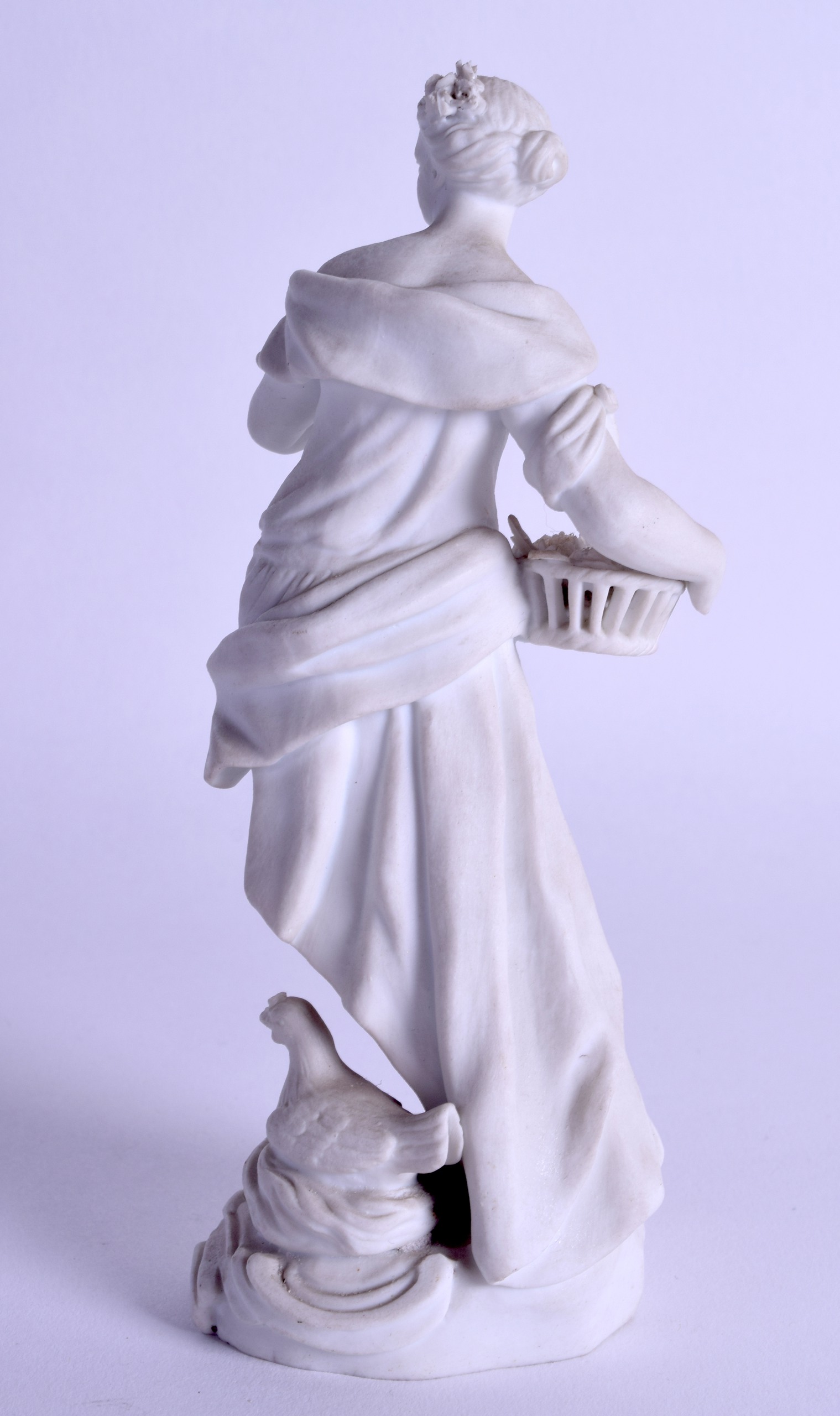 18th c. Meissen biscuit figure of woman in a flowing robe holding flowers in a basket standing on - Image 2 of 3