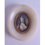 A 19TH CENTURY FRENCH PAINTED IVORY PORTRAIT MINIATURE depicting a pretty female, within a carved