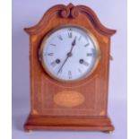 AN EDWARDIAN MAHOGANY MANTEL CLOCK with large circular enamelled dial, painted with black