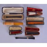 A COLLECTION OF VINTAGE CHEROOT HOLDERS including amber examples. (qty)