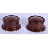 A PAIR OF EARLY 20TH CENTURY CARVED TREEN BOXES AND COVERS. 8.5 cm diameter.