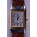 A LOVELY LADIES 18CT GOLD AND STEEL JAEGER LECOULTRE REVERSO WRISTWATCH with black numerals. 1.75 cm