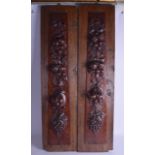 A PAIR OF 18TH/19TH CENTURY CONTINENTAL CARVED FRUITWOOD PANELS supported upon early oak plaques.