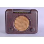 AN ART DECO BAKELITE BUSH RADIO, with circular metal speaker grill. 23 cm x 28 cm.