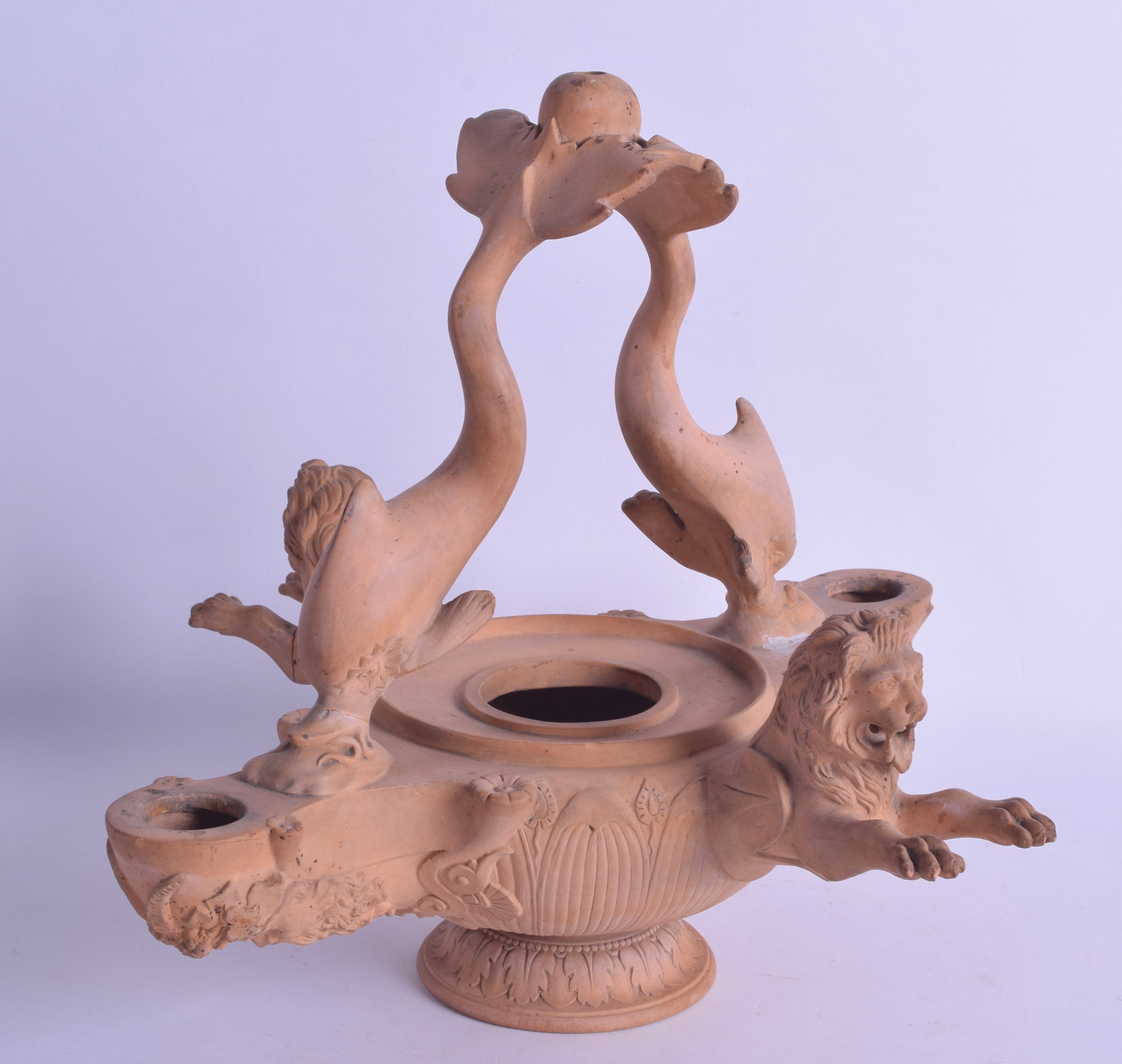 A GOOD 19TH CENTURY EUROPEAN GRAND TOUR TERRACOTTA CARVED LAMP decorated with fish and leaping