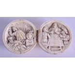 A MID 19TH CENTURY EUROPEAN CARVED DIEPPE IVORY BALL opening to reveal saints in various pursuits.