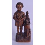 AN UNUSUAL 19TH CENTURY CARVED FRUITWOOD FIGURAL SEWING COMPANION with removable implements and