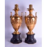 A FINE LARGE PAIR OF 19TH CENTURY ORMOLU TWIN HANDLED URN/OIL LAMPS by Barbedienne, modelled in