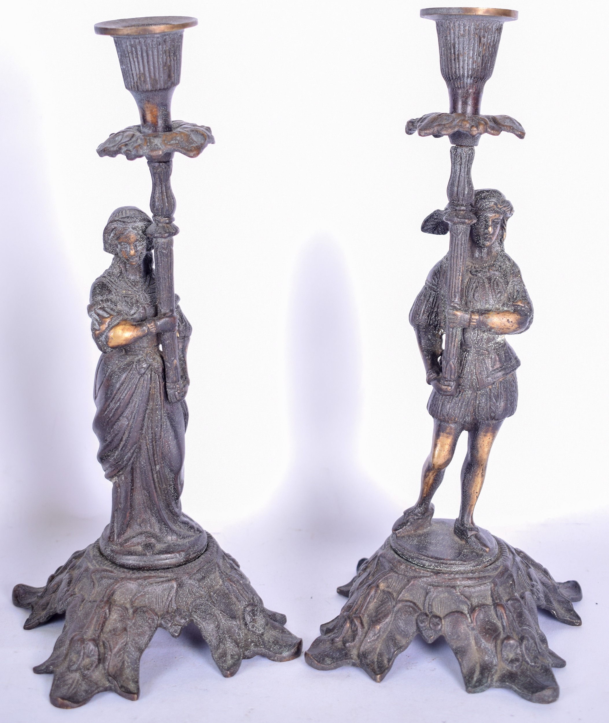 A PAIR OF EARLY 20TH CENTURY BRONZE CANDLESTICK HOLDERS, formed as a male and female. 28 cm high.