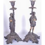 A PAIR OF EARLY 20TH CENTURY BRONZE CANDLESTICK HOLDERS, formed as a male and female. 28 cm high.