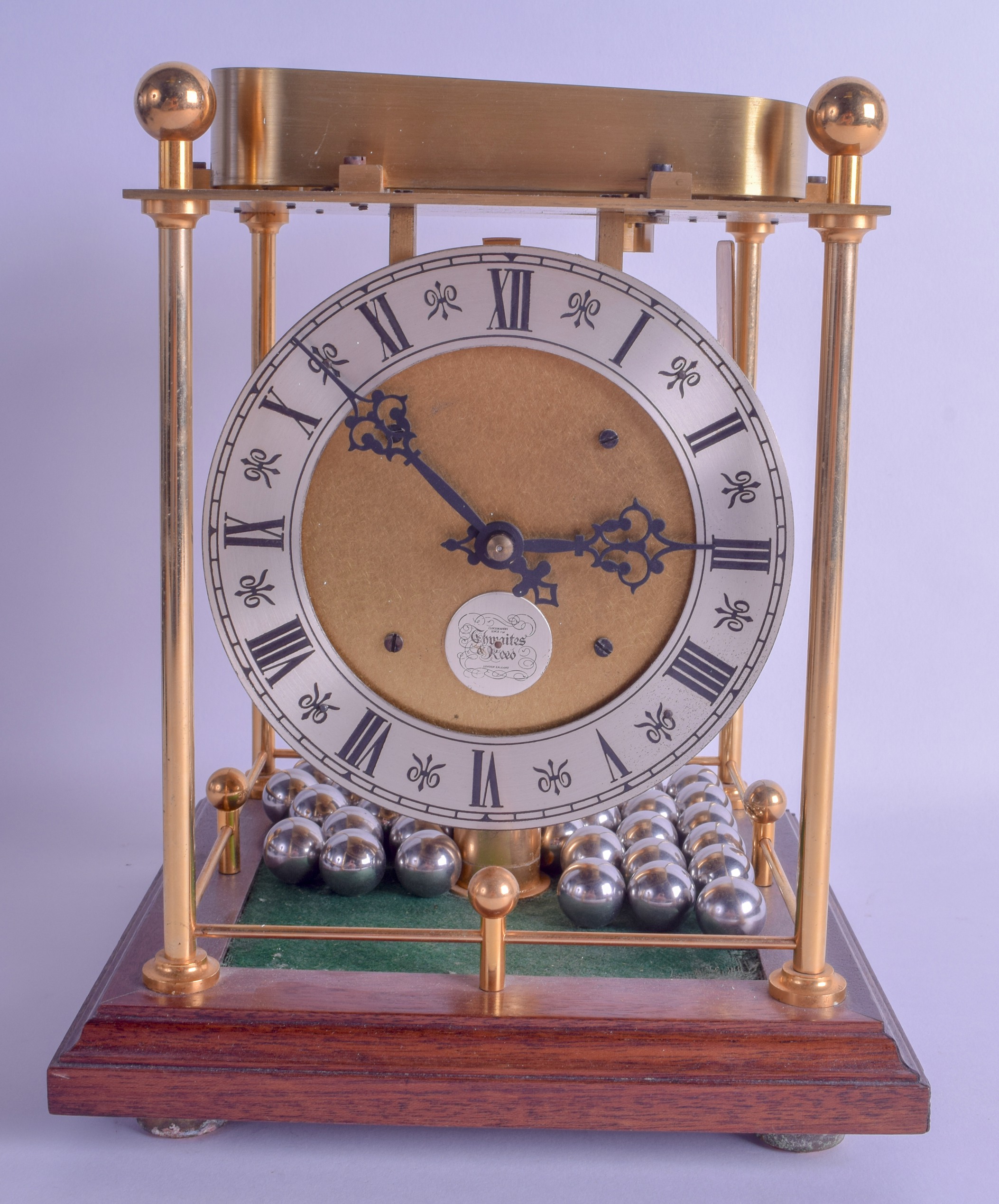 AN UNUSUAL THWAITES & REED LIMITED EDITION SPHEROID BALL CLOCK No 957 of 1000. 26 cm x 20 cm.