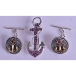 A SET OF SILVER AND RUBY ANCHOR CUFFLINKS & BROOCH. (3)