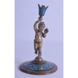 A 19TH CENTURY FRENCH BRONZE CHAMPLEVE ENAMEL CANDLESTICK modelled as a female holding aloft a