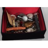 A QUANTITY OF WATCHES, contained with a mirrored velvet box. (qty)