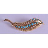 AN 18CT GOLD AND TURQUOISE NATURALISTIC BROOCH. 5.7 grams. 5.25 cm long.