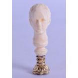 A MID 19TH CENTURY EUROPEAN CARVED IVORY SEAL with yellow metal mounts and carved amethyst base. 6.