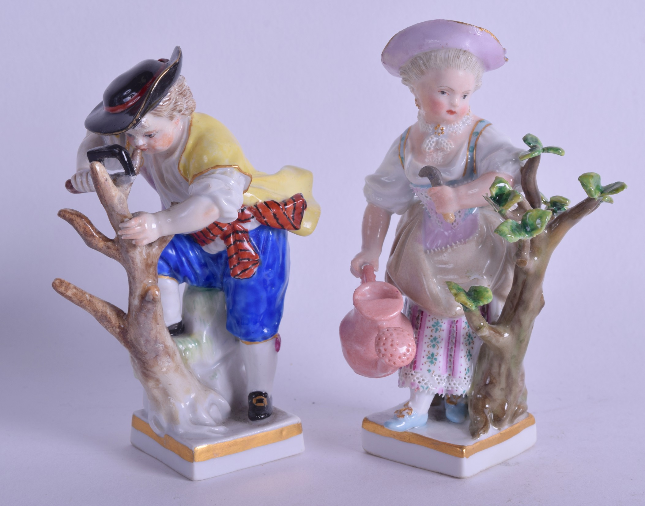 A PAIR OF 19TH CENTURY MEISSEN PORCELAIN FIGURES modelled gardening upon square form bases. 9 cm