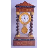 A FRENCH ROSEWOOD PORTICO CLOCK with gilt brass cherub encased dial, the case decorated with foliage