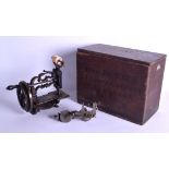 AN ANTIQUE JAMES G WEIRS PATENT LONDON SEWING MACHINE with ebonised handle and painted decoration.