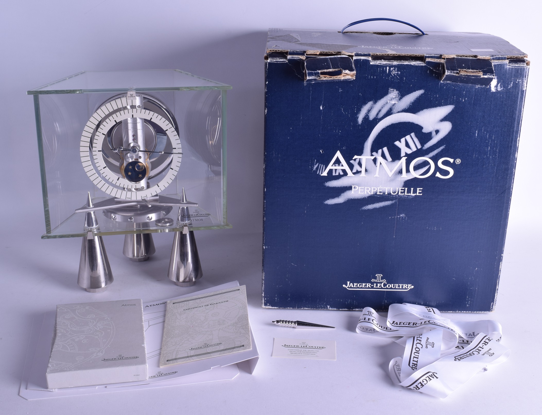 AN EXTREMELY RARE BOXED JAEGER LE COULTRE ATMOS CLOCK No. 680934, with moon phase and unusual