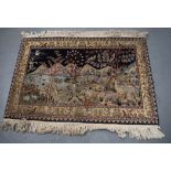 A BEIGE GROUND RUG, decorated with animals in various pursuits. 82 cm x 124 cm.