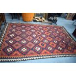 A LARGE INDIAN WOOL RUG, with stylish design. 293 cm x 198 cm.