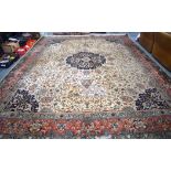 A HUGE EARLY/MID 20TH CENTURY IVORY GROUND ISFAHAN OR TABRIZ RUG, beautifully deocrated with