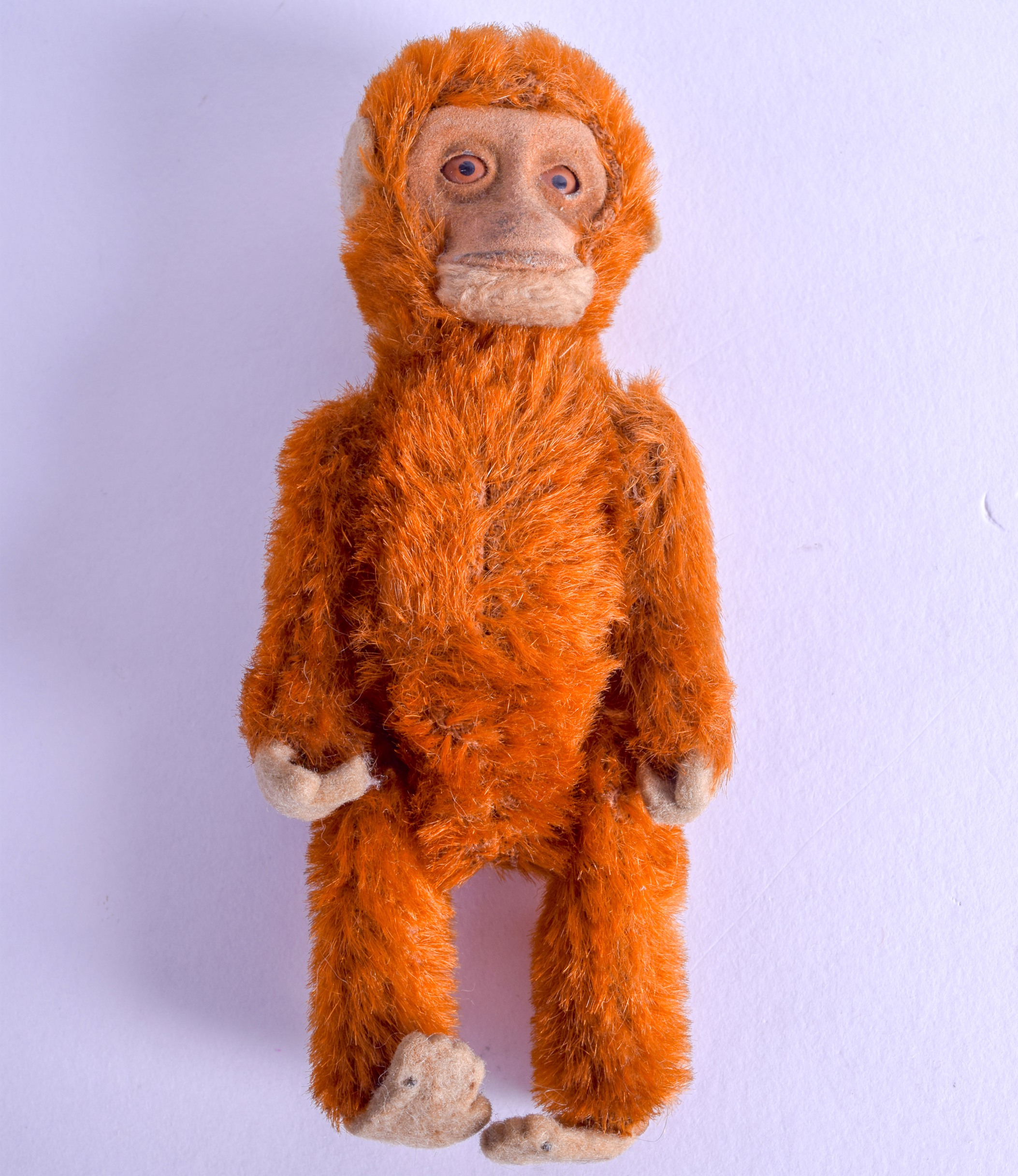 A RARE SCHUCO SCENT BOTTLE AND STOPPER unusually in the form of a red monkey. 11.75 cm high.