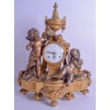 A LARGE 1950S ITALIAN BRASS AND BRONZE MANTEL CLOCK of classical form, modelled as two nude putti in
