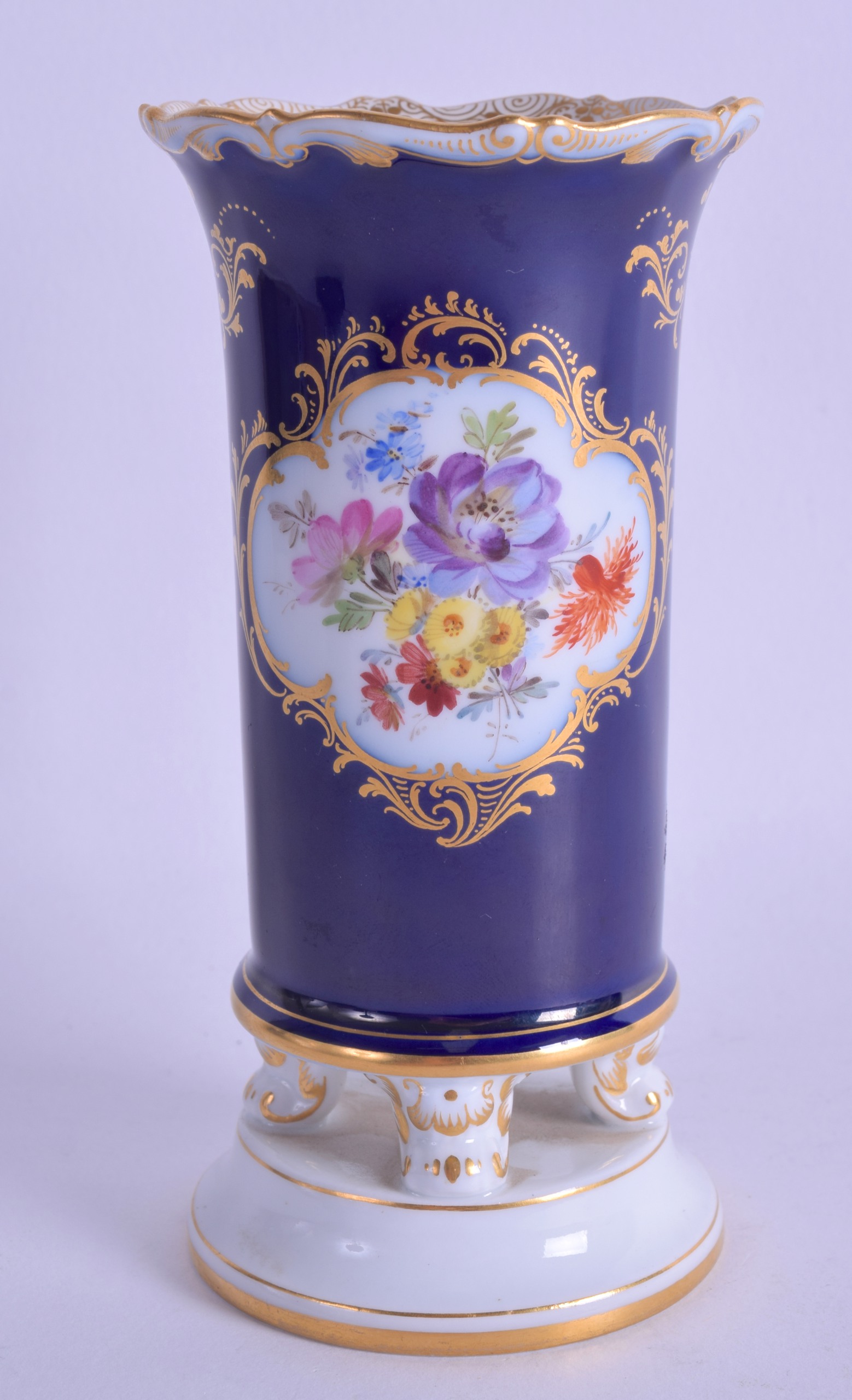 A LATE 19TH CENTURY MEISSEN PORCELAIN SPILL VASE painted with flowers upon a blue ground. 14 cm - Image 2 of 3