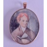 AN EARLY 19TH CENTURY EUROPEAN PAINTED IVORY PORTRAIT MINIATURE depicting a male holding a book. 3.