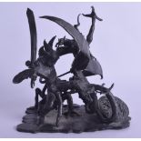 AN UNUSUAL 1970S BRONZE FIGURE OF A MYTHICAL DRAGON modelled being attacked by a beast. Signed DE