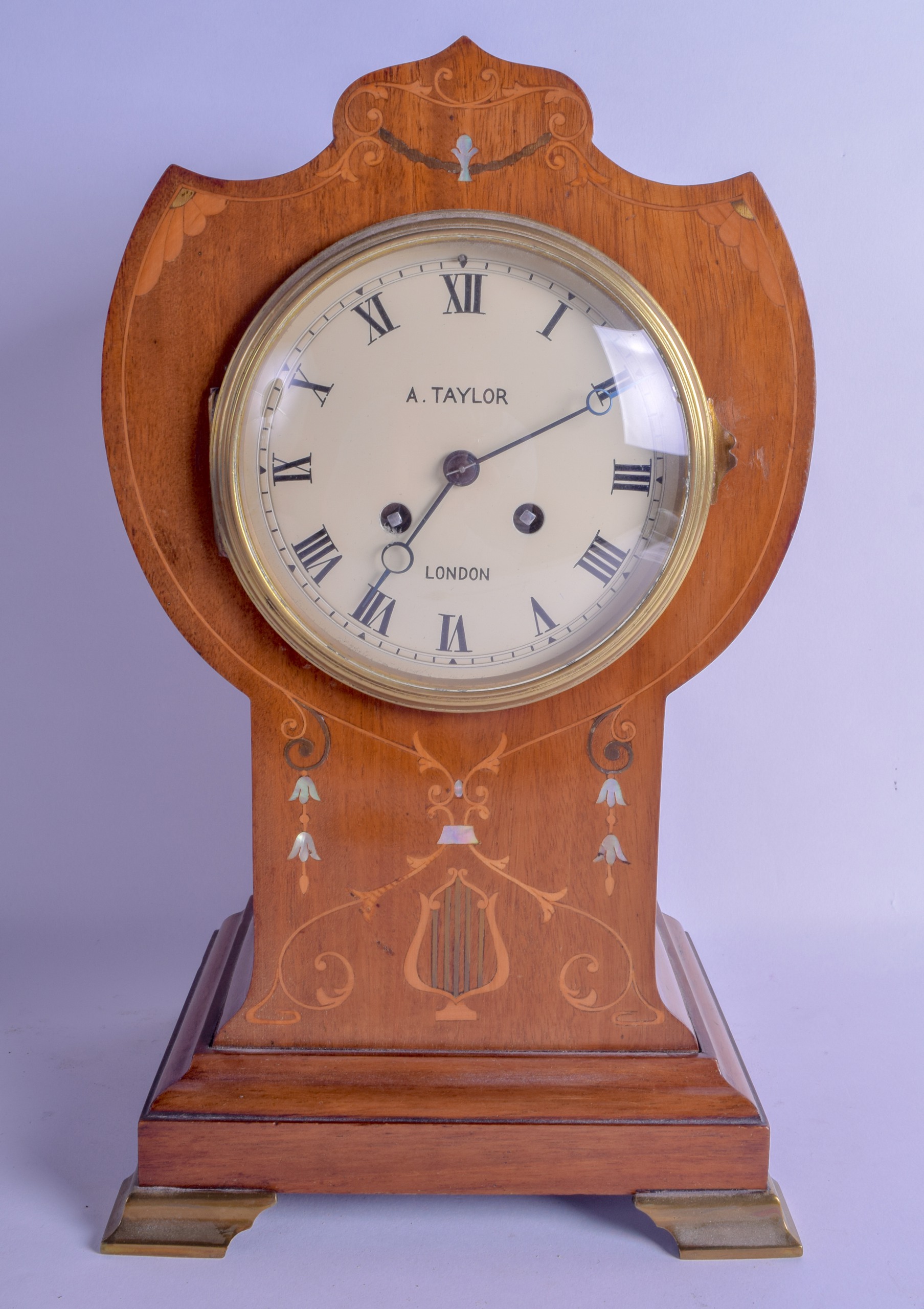 A STYLISH EDWARDIAN MAHOGANY MOTHER OF PEARL INLAID MANTEL CLOCK signed A Taylor of London. 35 cm