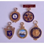 A GROUP OF FIVE EARLY 20TH CENTURY 9CT GOLD AND ENAMEL MEDALLIONS including the Mersey Shipping &