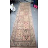 A PERSIAN GARDEN RUNNER RUG, decorated with panels of foliage. 354 cm x 92 cm.