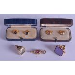 A PAIR OF ANTIQUE GOLD DRESS STUDS together with two watch fobs & a key. (5)