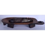 A WOODEN TRIBAL OFFERING BOWL, together with an African mask. Bowl 43 cm long.