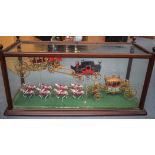 A GOOD CASED MODEL, depicting horses and various carriages contained withing a glass fronted