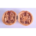 A MID 19TH CENTURY EUROPEAN CARVED DIEPPE IVORY BALL opening to reveal figures on horseback. 12 cm