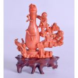 A GOOD 19TH CENTURY CHINESE CARVED CORAL SNUFF BOTTLE AND STOPPER modelled as two children