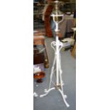 AN ANTIQUE WROUGHT IRON STANDARD OIL LAMP, painted white with twist fittings. 140 cm high.