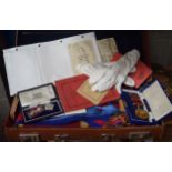 A LEATHER CASE containing masonic regalia. (qty)