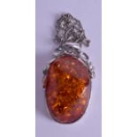 A LARGE SILVER AND AMBER NECKLACE. Pendant 6 cm x 4.25 cm.